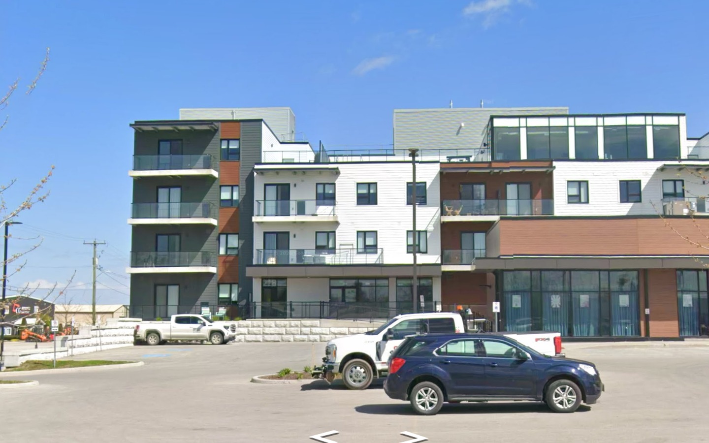 Street-level exterior of the mixed-use building at 207 Main Street North in Exeter, Ontario